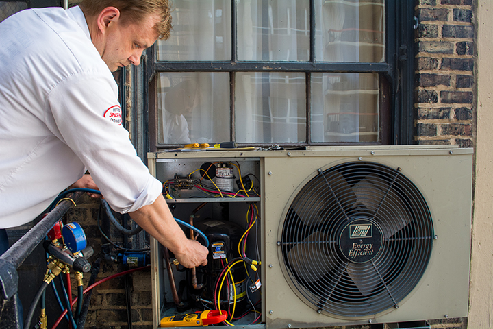 Technician working on an air conditioner
