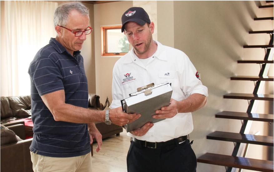 American Vintage Home HVAC technician discussing options with a homeowner
