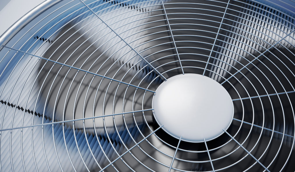 Close up view of a fan on an air conditioning unit