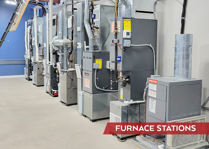 Multiple furnace forced hot air heating stations installed next to each other for education and comparison by customers